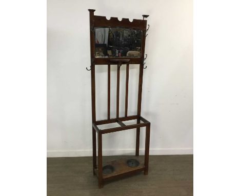 STAINED WOOD HALLSTAND EARLY 20TH CENTURY mirror back with two hooks above stick/umbrella sections and two drip trays63cm wid