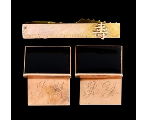 A Pair of Onyx Set 14ct Gold Cuff Links, and 14ct gold tie pin with Oriental design, total gross weight 12.7gThe cufflinks ap