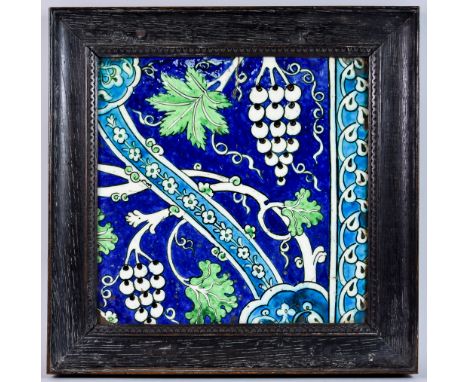 A Damascus or Syrian Ware Border Tile, Late 16th/17th Century, typically painted in turquoise, blue, green, purple and black,