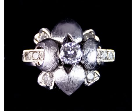An 18ct White Gold Diamond Ring, of heart design, set with centre brilliant cut white diamond, approximately .3ct, surrounded