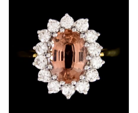 An 18ct Gold Diamond and Spinel Ring, set with a centre faceted spinel, approximately 2ct, surrounded by brilliant cut white 