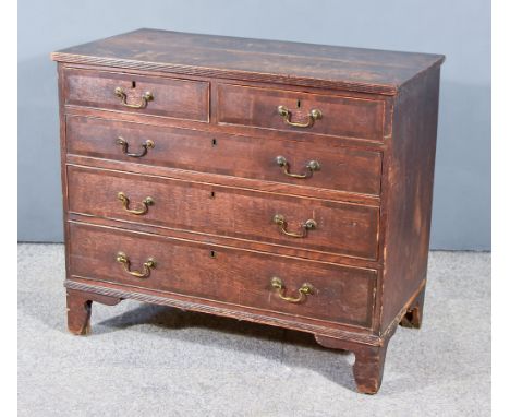 A George III Oak Chest, with reeded edge to top, fitted two short and three long graduated drawers, on bracket feet, 37ins wi