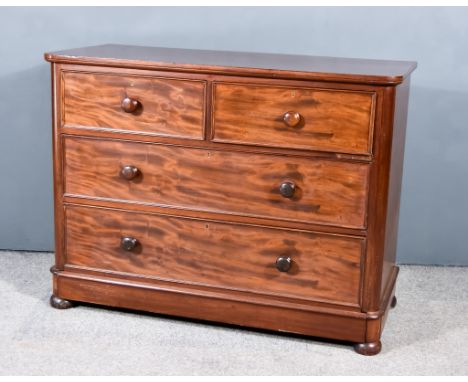 A Victorian Chest, with square edge to top, fitted two short and two long drawers, on plinth base with turned feet, 39ins wid