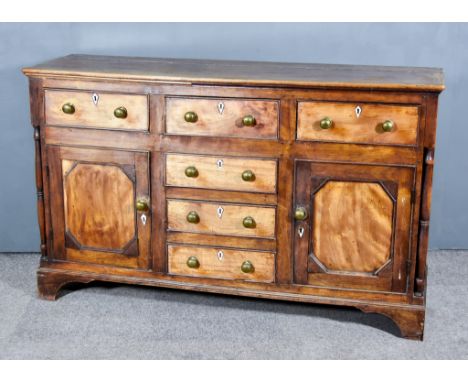 A Late 18th/Early 19th Century Mahogany Dresser Base, with moulded edge to top, fitted six drawers flanked by two cupboards e