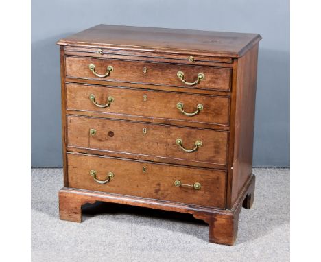 A George III Mahogany Chest of small proportions, with moulded edge to top, fitted slide and four long graduated drawers unde
