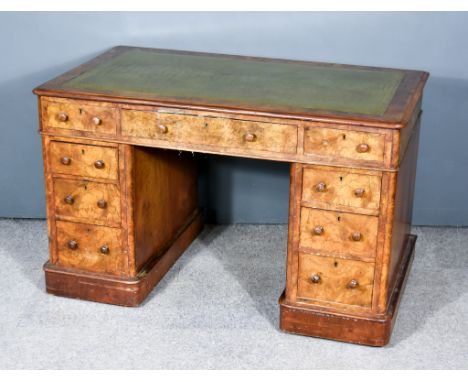An Early Victorian Figured Walnut Kneehole Desk, with moulded edge and green and gilt leather tooled leather inset to top, fi