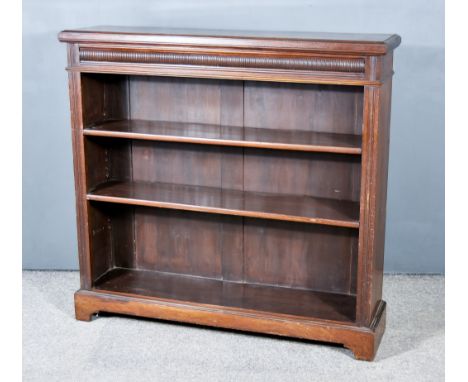 An Edwardian Mahogany Dwarf Bookcase, with moulded edge to top, fluted frieze, fitted two open shelves flanked by moulded upr