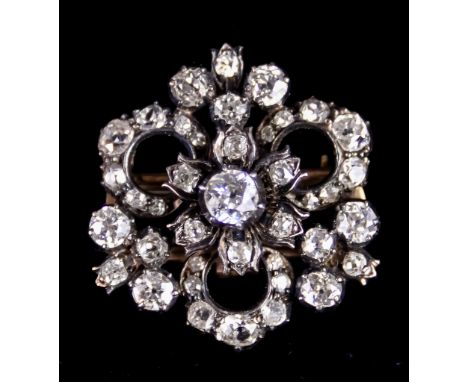 A Late Victorian Flower Head Brooch, silver and gold coloured metal set with old European cut diamonds, approximately 4ct tot