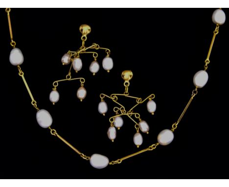 A Baroque Pearl Suite, comprising - yellow metal (tests as 14ct gold) necklace formed of metal bars interspaced with baroque 