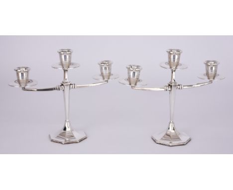 A Pair of Elizabeth II Silver Three Light Candelabra, by Henry Clifford Davis, Birmingham 1956, with reeded sconces and wide 