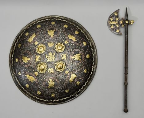 An Indo-Persian Shield (Taj), 19th Century, with four brass bosses and applied figural subjects, and with engraved and copper