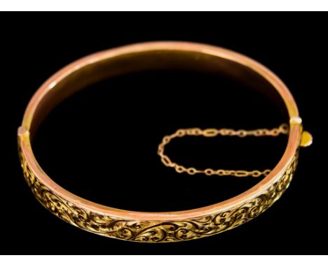 A 9ct Gold Stiff Bangle, 64mm diameter, total gross weight 9.1gThe bangle appears to be in good overall condition showing wea