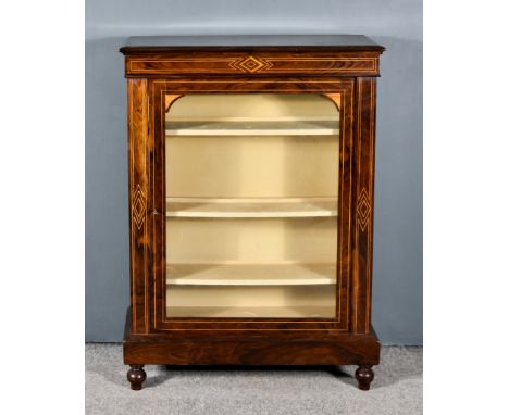 A Victorian Figured Walnut Pier Cabinet, with moulded edge to top, fitted three shelves enclosed by single glazed panelled do