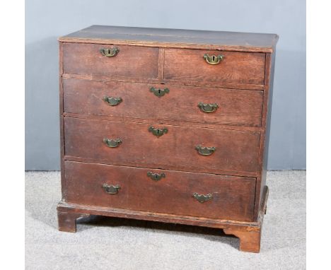 A George III Oak Chest, with moulded edge to top, fitted two short and three long graduated drawers, on bracket feet, 36ins w