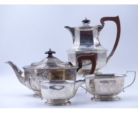 A FOUR PIECE SILVER SERVICE COMPRISING OF A PRESENTATION ENGRAVED  TEA POT, COFFEE POT, SUGAR AND CREAM. HALLMARKED BIRMINGHA