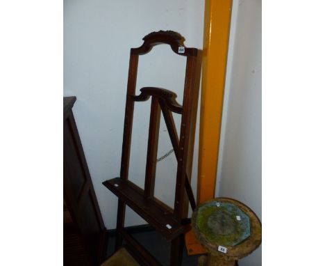 A CARVED OAK DISPLAY EASEL.