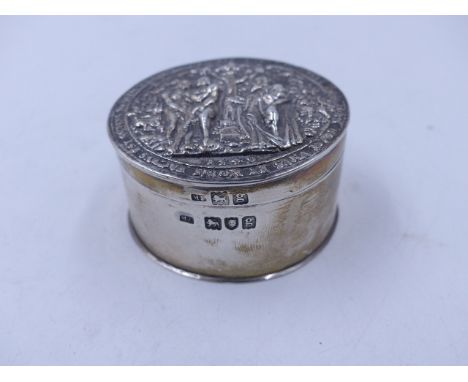 A SILVER HALLMARKED CIRCULAR TRINKET BOX WITH A HINGED COVER, DEPICTING A BIBLICAL SCENE, DATED 1902, LONDON, POSSIBLY MAURIC
