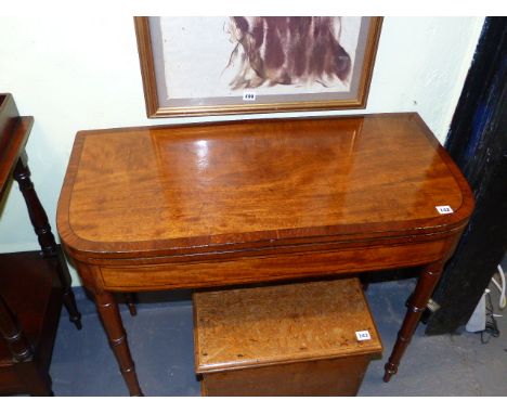 A REGENCY MAHOGANY AND INLAID FOLD OVER CARD TABLE ON TURNED TAPERED LEGS.   W.92cms.