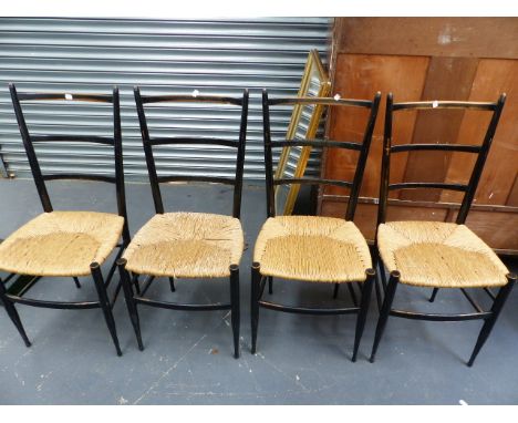 A SET OF TEN GIO PONTI DESIGN EBONISED LADDER BACK RUSH SEAT SIDE CHAIRS.
