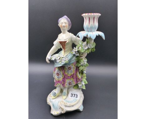 A 19th.C. FIGURATIVE CANDLESTICK EMBLEMATIC OF SUMMER IN THE DERBY MANNER.   H. 27cms.