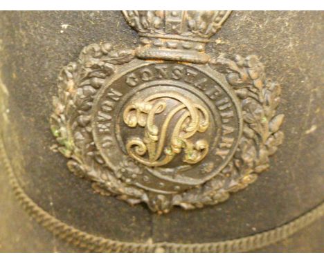 A VICTORIAN BLACK CLOTH DEVON CONSTABLE POLICE HELMET.