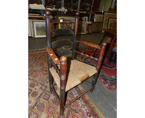 AN 18th.C.COUNTRY LADDER BACK SIDE CHAIR WITH RUSH SEAT.