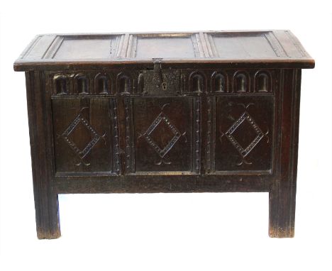 17th century oak jointed chest, three panel top above three panelled front, gouged carving to top rail, external lock, diamon