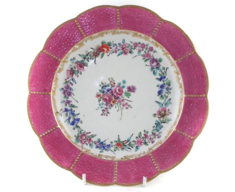Worcester plate circa 1770, painted with flowers within a pink basket moulded border,&nbsp; (the pink border colour is possib