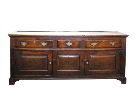 18th century oak dresser base, rectangular top with moulded edge above three frieze drawers, fitted steel locks and replaceme