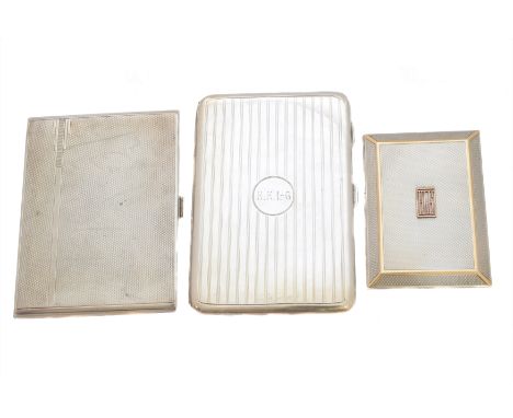 Three silver cigarette cases, each of rectangular outline, to include a 1920s Asprey cigarette case, and two others with engi