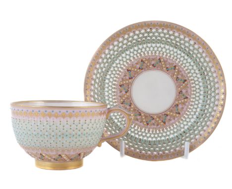 Royal Worcester reticulated cup and saucer by George Owen, the hexagonal cut body applied with turquoise, white and gilt jewe