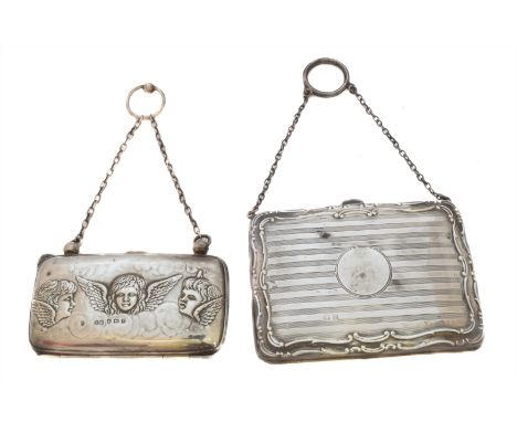 Two early 20th Century silver purses, each of rectangular form suspended from a trace link chain, the first with vacant centr