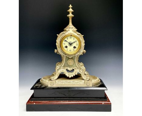 A late 19th century metal and black slate mantel clock, height 48cm, width 38cm.