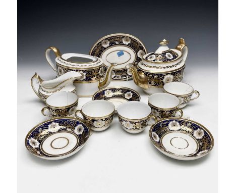 Early 19th century Spode teaware, decorated in blue and gilt, comprising two teapots, a teapot stand, a milk jug, five teacup