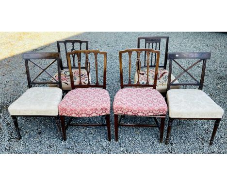 A pair of Regency mahogany dining chairs with carved X backs, stuffover seats on turned front legs, together with another pai