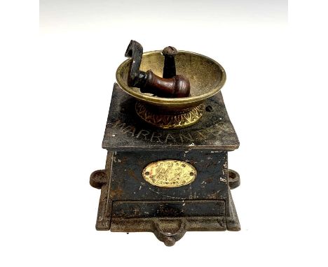 An early 20th century E.Pugh and Co. cast iron coffee grinder.