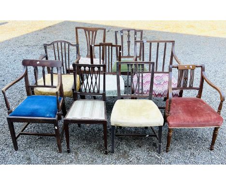 A late George III mahogany elbow chair of Sheraton design, three other elbow chairs of a similar date, and five other chairs 