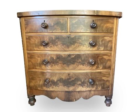 A Victorian mahogany bow front chest of drawers, with two short and three long drawers, on turned feet, height 121cm, width 1