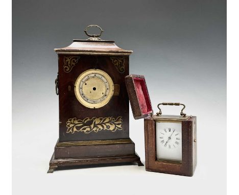 A 19th century mahogany brass inlaid mantel clock and a brass carriage clock, in original leather case (2). 