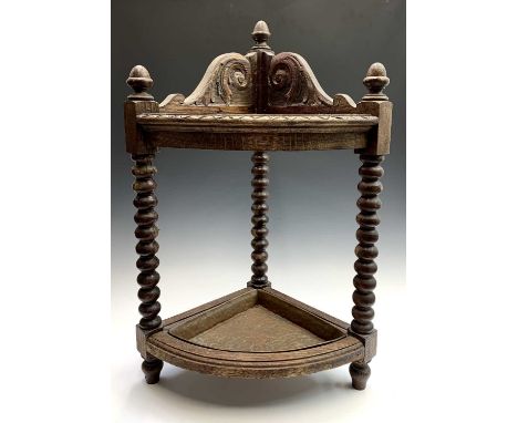 A Victorian carved oak corner stick stand, with bobbin turned supports and copper drip tray. Height 83cm, width 51cm, depth 4