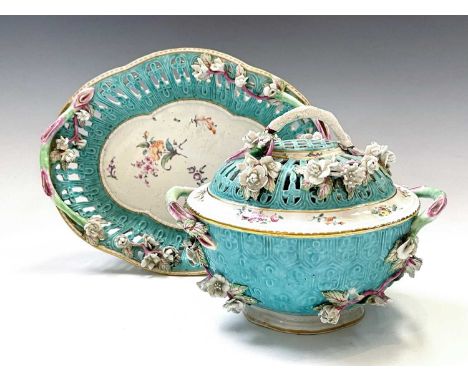 A rare Worcester porcelain chestnut basket, cover and stand, circa 1770, the turquoise ground with painted and floral encrust