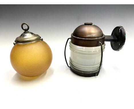 An exterior lamp, of maritime form, the metal mounts with copper finish and moulded glass shade, height 21cm, together with a