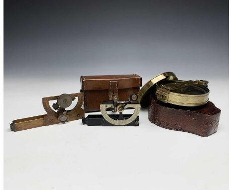 A prismatic brass surveying compass, late 19th century, with silvered dial, diameter 10cm, in leather case, together with an 