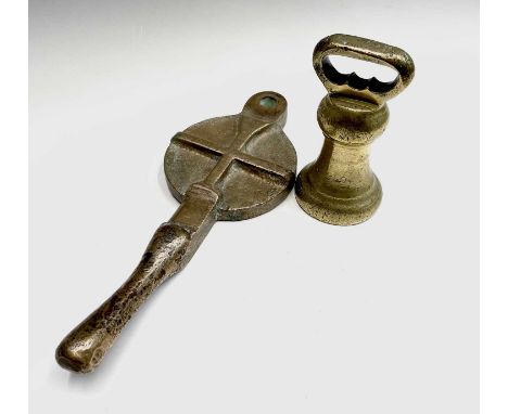 A Victorian brass bell weight, height 17cm, and one other item, length 37cm (2).