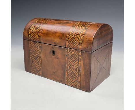 A Victorian walnut and parquetry inlaid tea caddy of domed form.