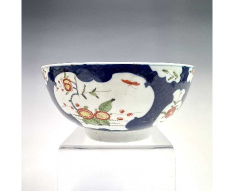 A Worcester porcelain sugar bowl, circa 1780, with painted floral reserves within a blue scale ground, blue seal mark, height