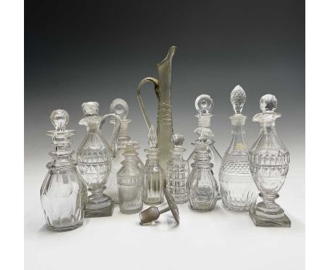 Two Georgian triple ring neck glass decanters and stoppers, both 23cm, together with several other small decanters, cruet bot