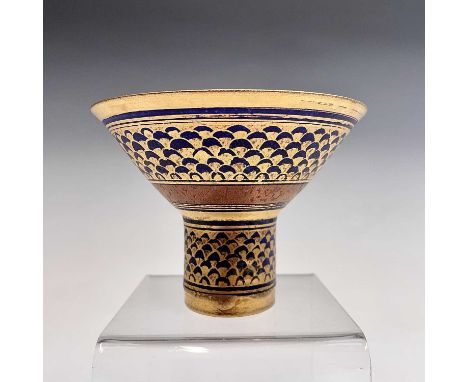 A Mary Rich studio porcelain stemmed bowl, the blue ground gilt decorated in a scale effect, height 9cm, diameter 12cm.Condit