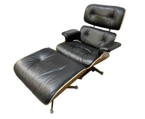 A Charles Eames style lounge chair and ottoman stool, height of chair 87cm, width 79cm.Condition report: A button is missing 