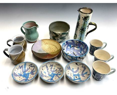 A Celtic pottery tall jug, painted with a bird and stars, height 26cm, together with other studio pottery mugs, bowls and a j